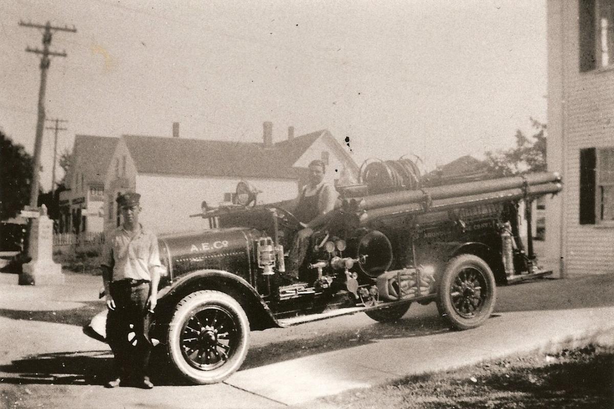 Atlantic Hose Co. (Cape Porpoise) members Clayton Nunan and Wendell "Web" Cluff with their 1931 Reo pumper on the ramp at Atlantic Hall. The truck was given to the Cape in 1934 by the Village Company. (Photo courtesy of Nunan's Lobster Hut)