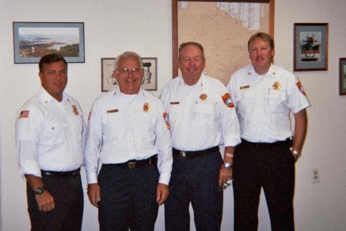 The End of an Era: Chiefs Plamondon, Beard, Chisholm, & Brown pose for a last photo of the "four chiefs" during the interviews for the new combined chief's position in 2005. (Photo by Jim Stockman)