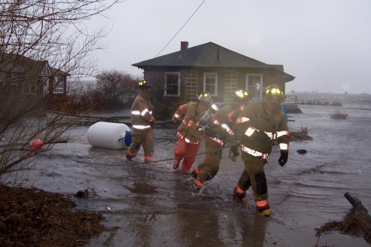 April 2007: Kennebunkport experienced the most severe coastal storm in 15 years resulting in power outages, downed trees and power lines and flooding in various parts of town. Here, firefighters secure a propane tank in a flooded section of Greer Road in Cape Porpoise.