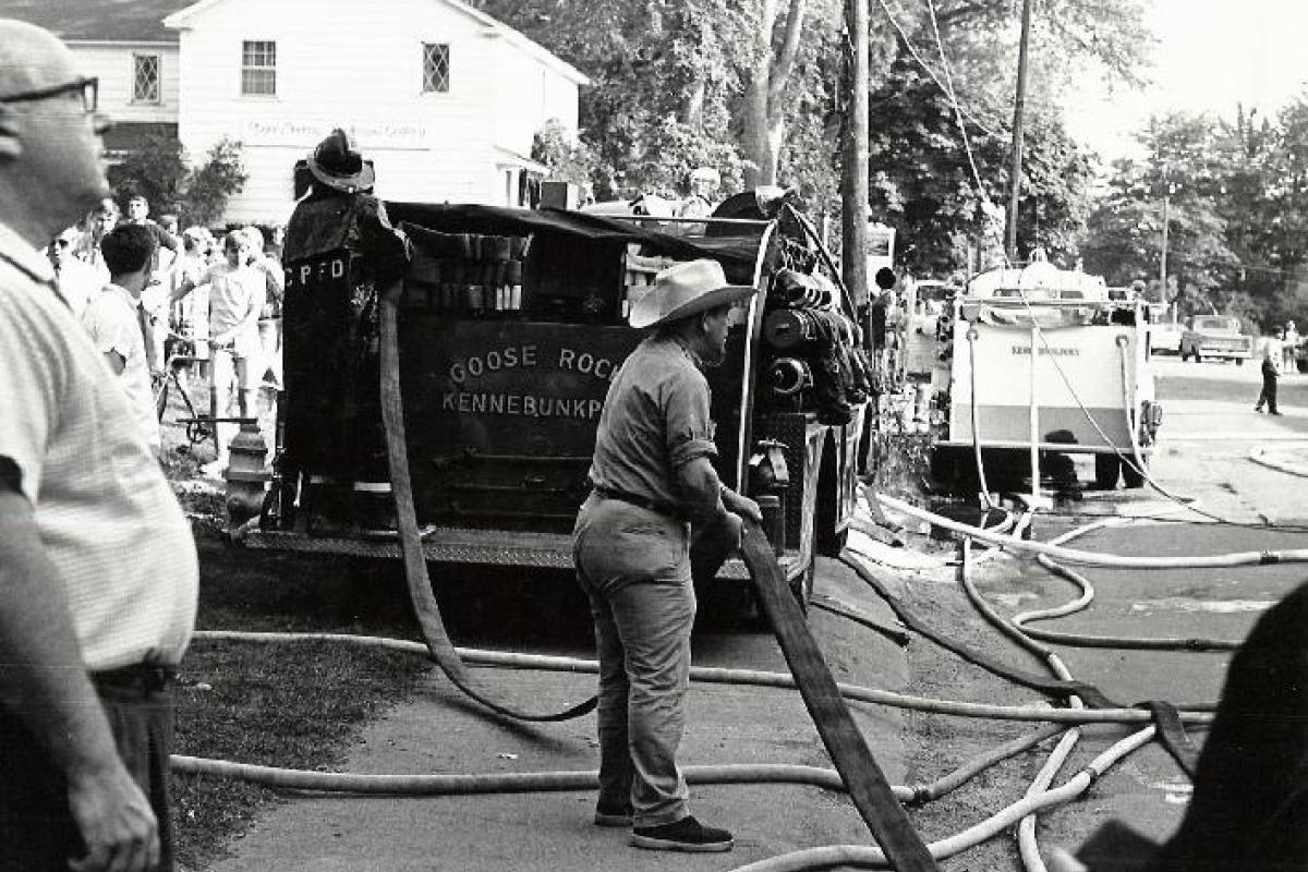 The Seagull Restaurant fire on Ocean Ave in the 1960's.  "Emmy" McLean, wearing the cowboy hat, helps with hose.