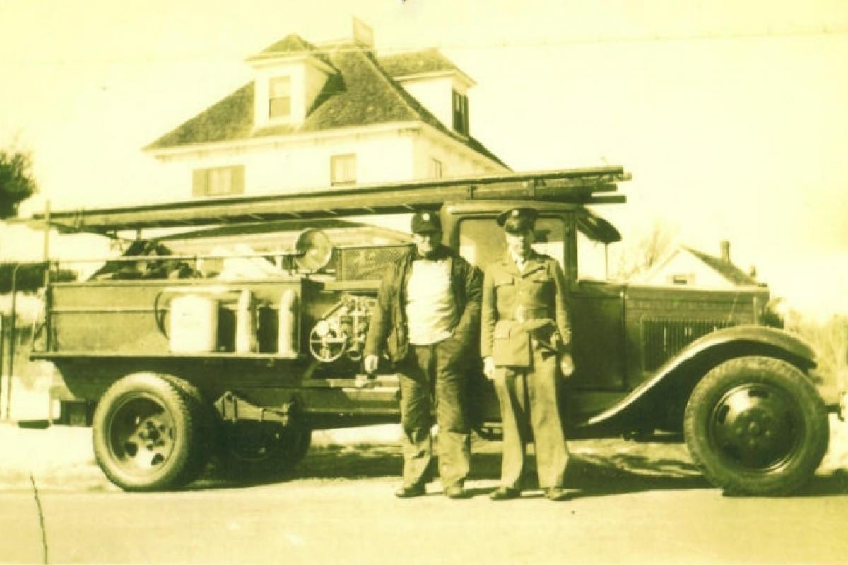 A photo dated 1944 shows Walter "Coop" Shuffleburg and young Clayton Shuffleburg with the Wildes District engine of the time, a converted 1931 Ford.